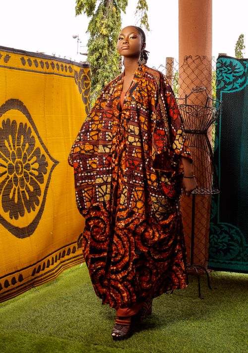 Free Beautiful woman posing in traditional African attire with intricate patterns. Stock Photo