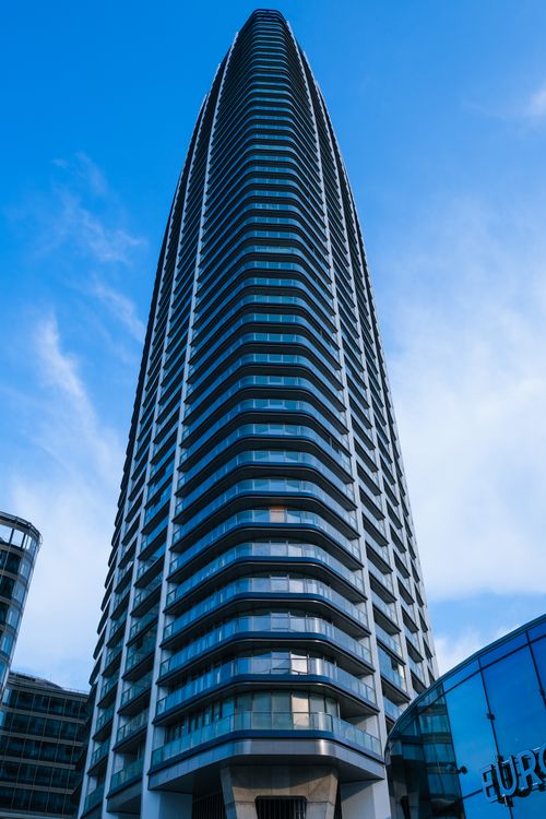 Free Impressive modern skyscraper in Bratislava's financial district under a clear blue sky. Stock Photo