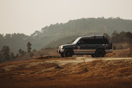 View of a Mitsubishi Pajero Driving on a Dirt Road