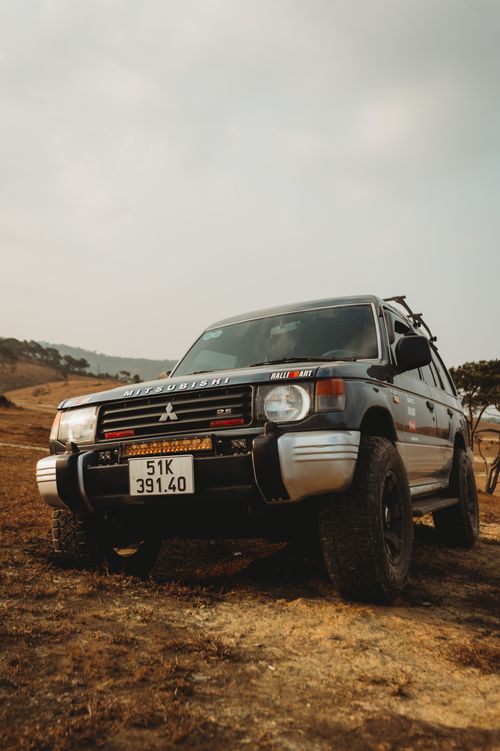 Free Mitsubishi Pajero on an adventure in a dry, rural terrain. Stock Photo