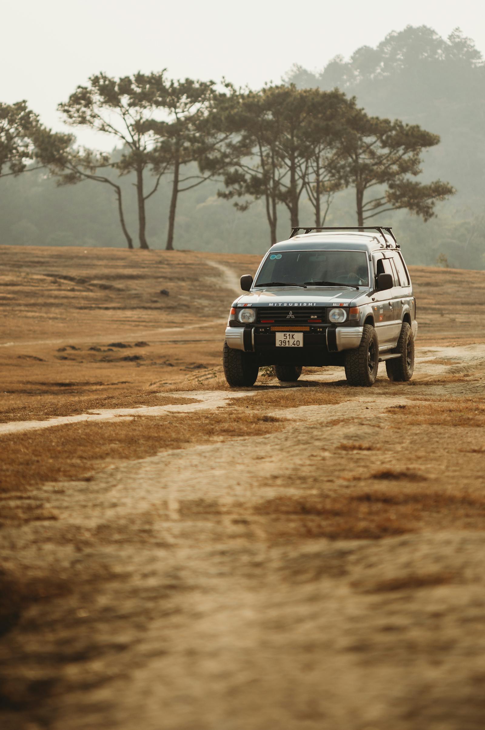 4×4 on a dirt road — stock photo for layout