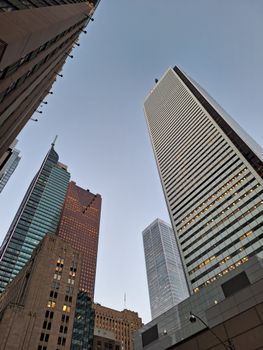 A captivating view of modern skyscrapers against a clear blue sky in an urban setting.