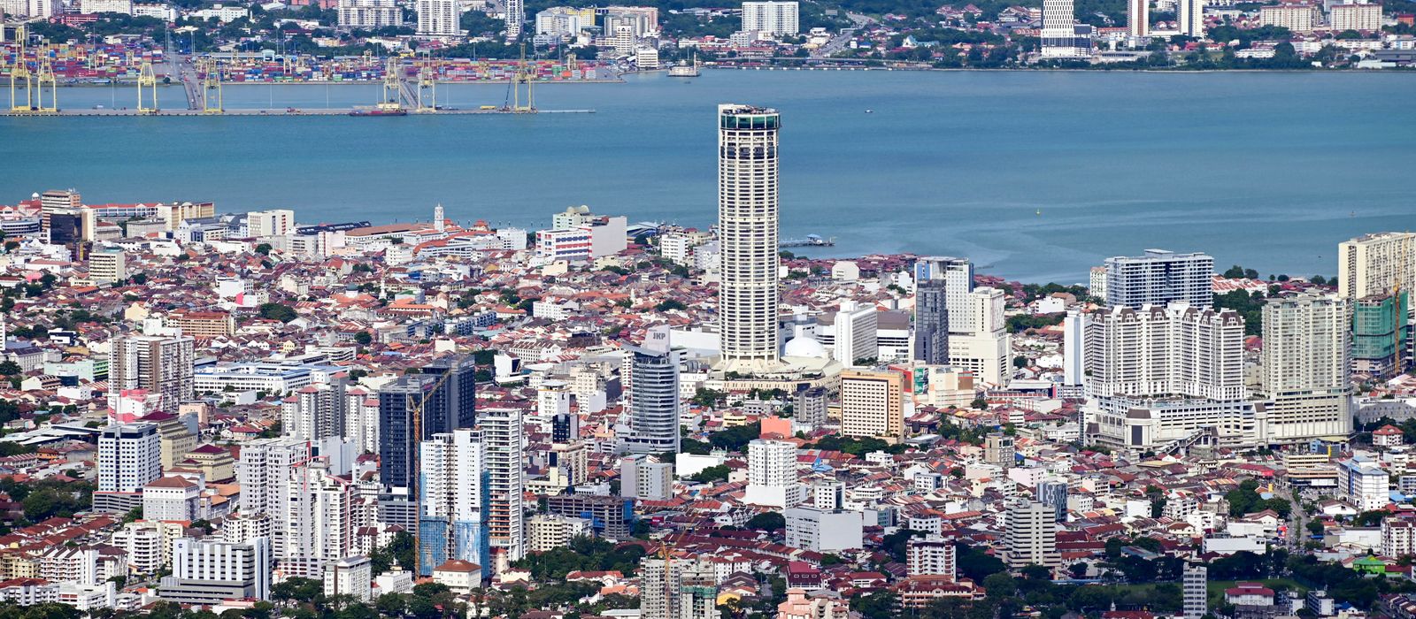 A stunning aerial view of George Town, Penang showcasing the urban landscape and coastal beauty.