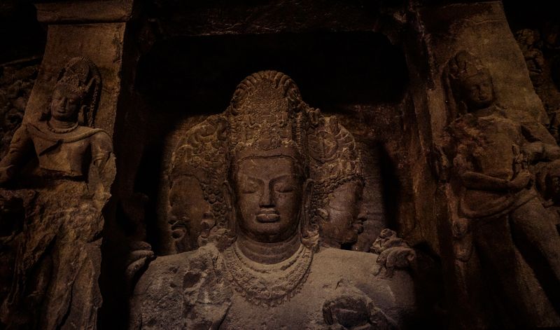 Carved Shiva sculptures inside the Elephanta Caves near Mumbai