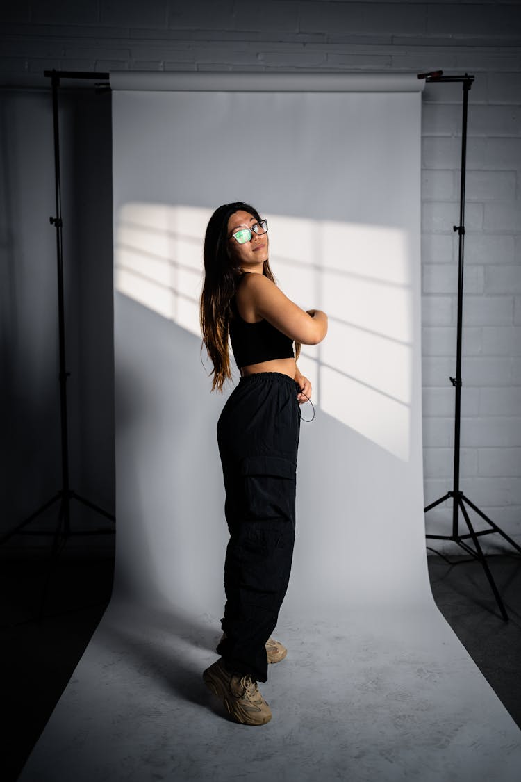 Woman In Black Outfit In A Studio