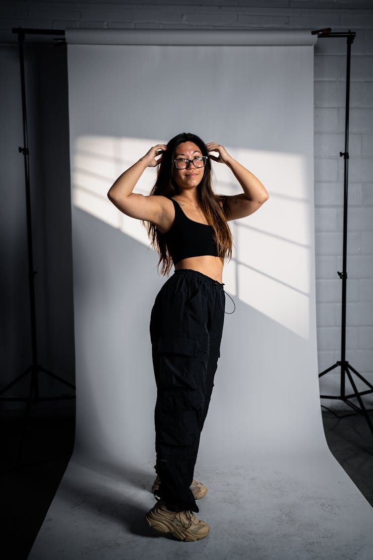 Woman In Black Outfit In Studio 