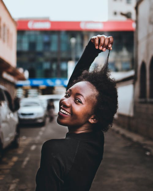 Photo of Woman Holding Her Hair
