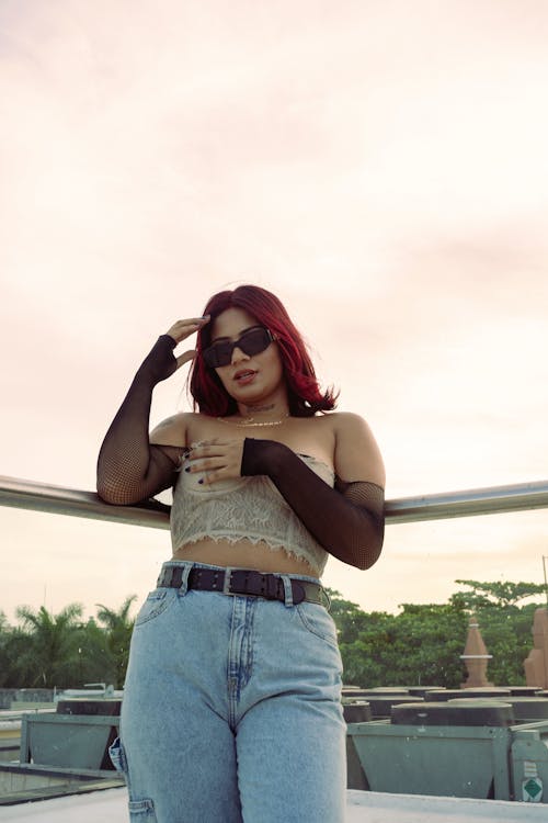 Free Young Woman with Dyed Hair Wearing a Trendy Outfit Posing Outside  Stock Photo