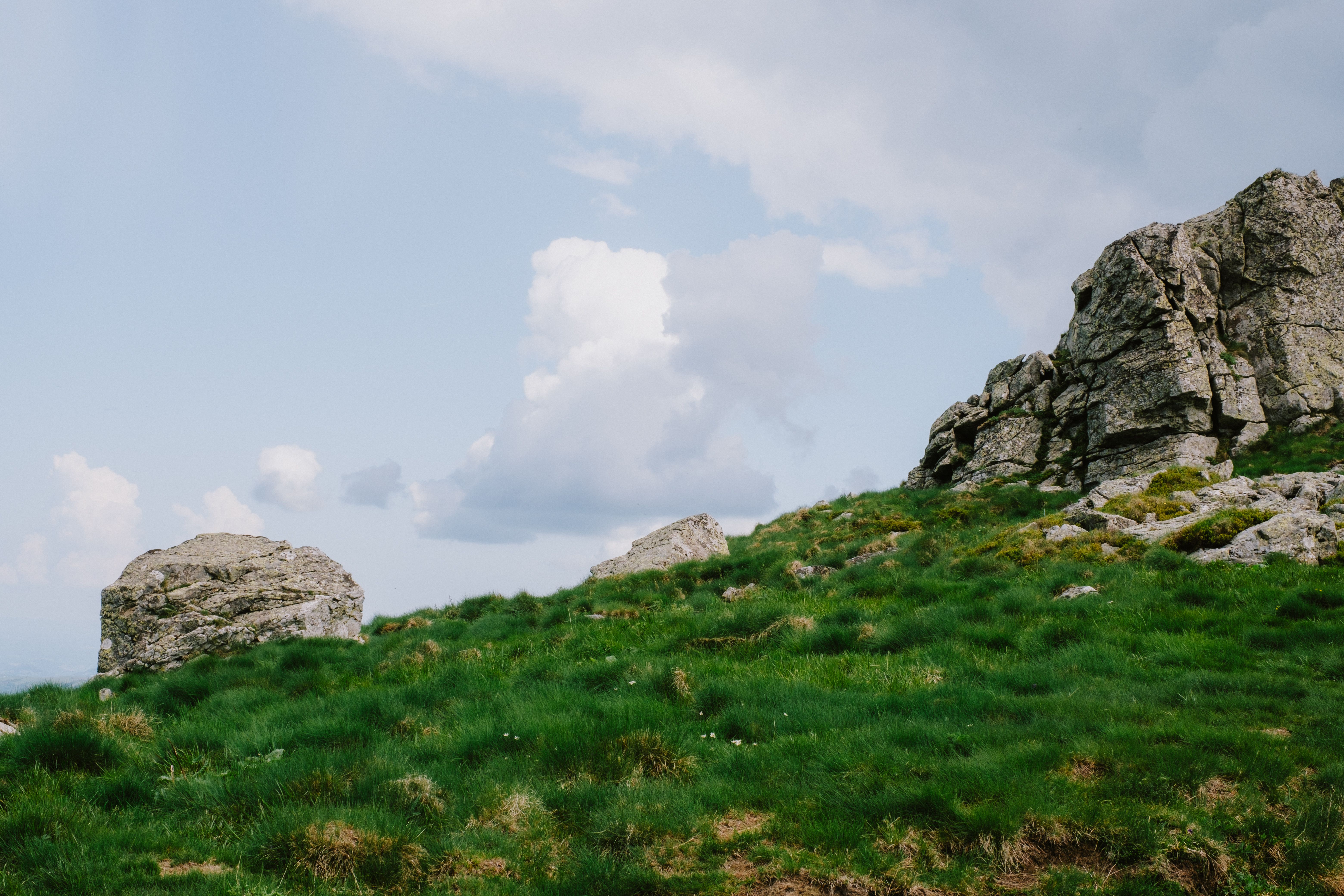 Rocks and Grass on Green Hill · Free Stock Photo