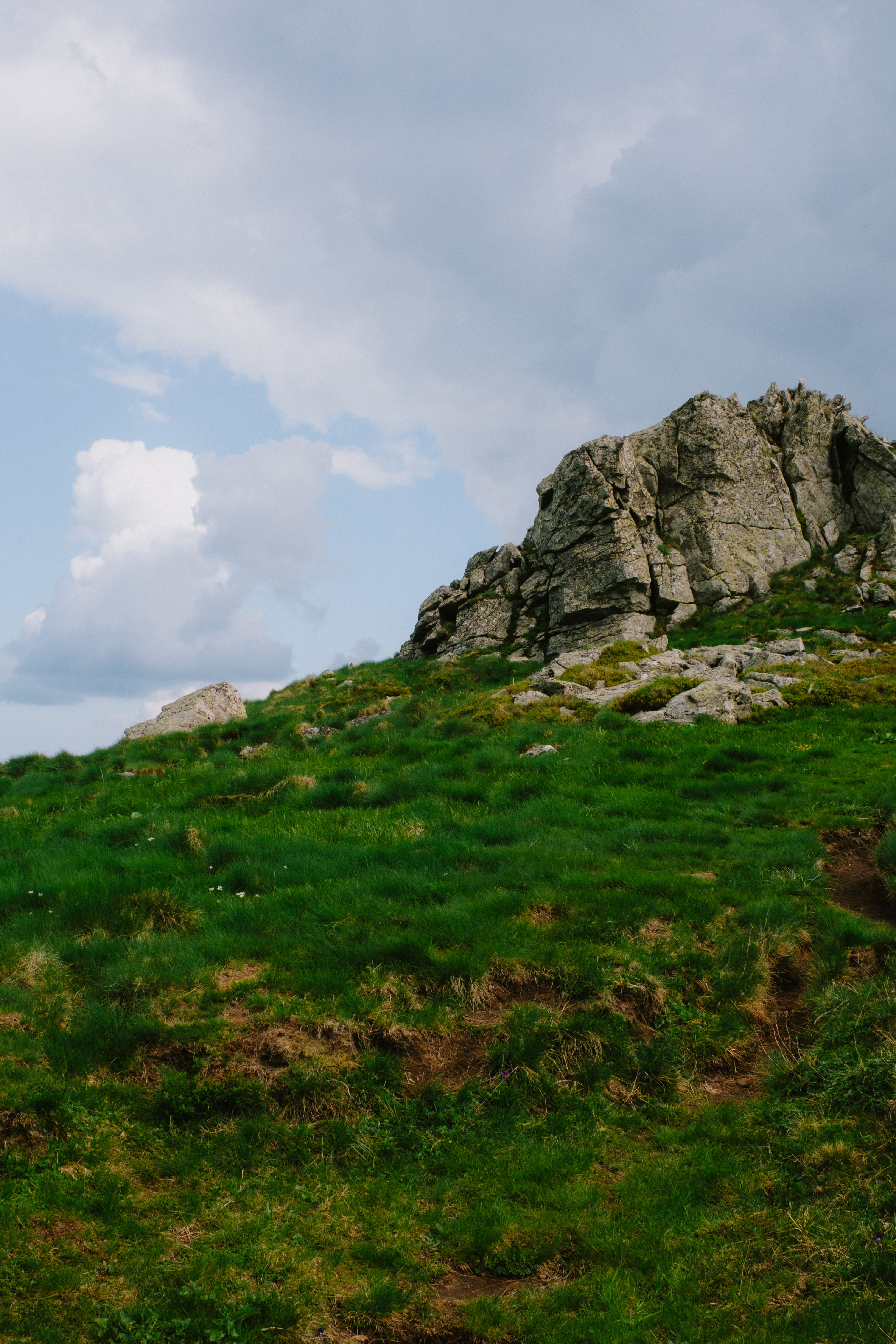 Green Hill with Rocks · Free Stock Photo