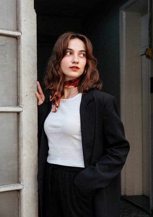 Portrait of Woman Standing by Wall