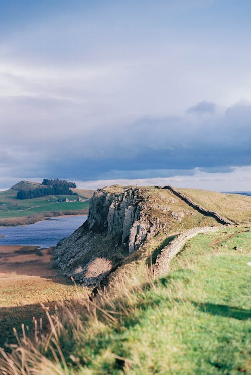 Free Hilly Landscape with Hadrian Wall near Crag Lough Lake, England Stock Photo