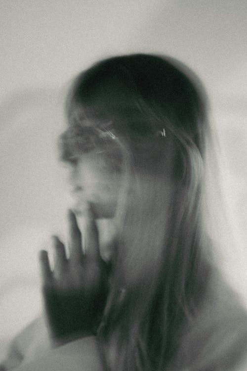 Free Blurred Woman with Long Hair Stock Photo