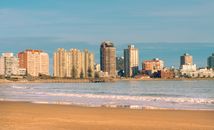 Scenic view of Punta del Este skyline along Playa Mansa beach at sunset, Uruguay's premier resort city.