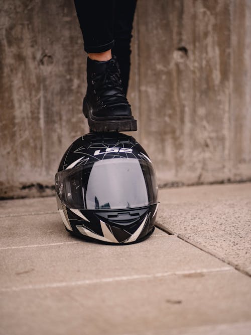 Foot on Motorcyclist Helmet