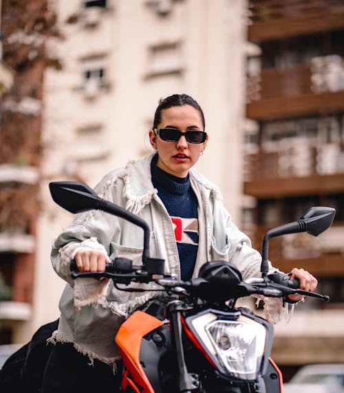 Woman in Jean Jacket on Motorbike