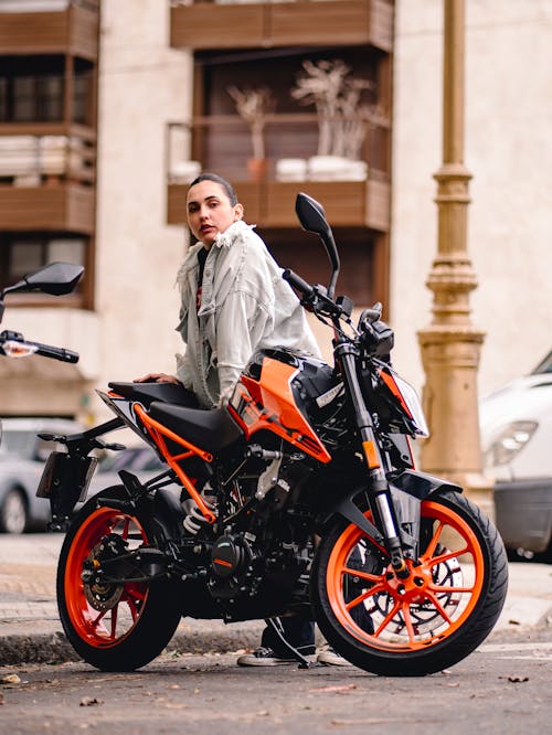 Woman Standing with Motorbike