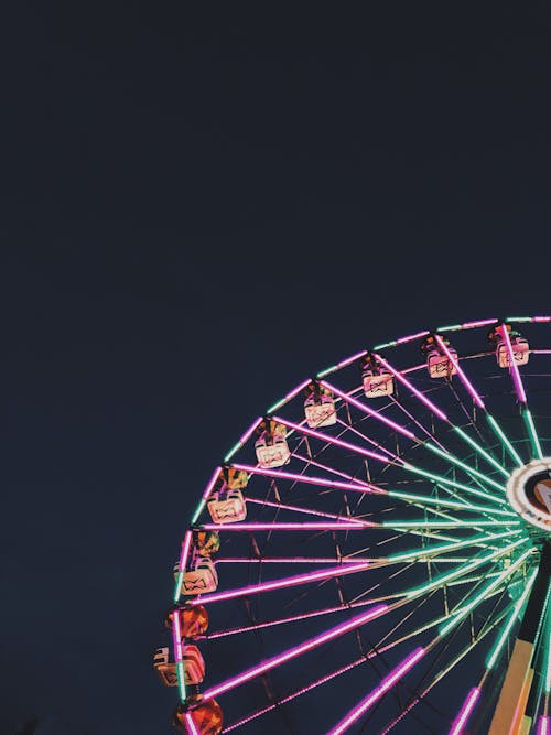 Free Photo of Ferris Wheel with Neon Lights at Night Stock Photo