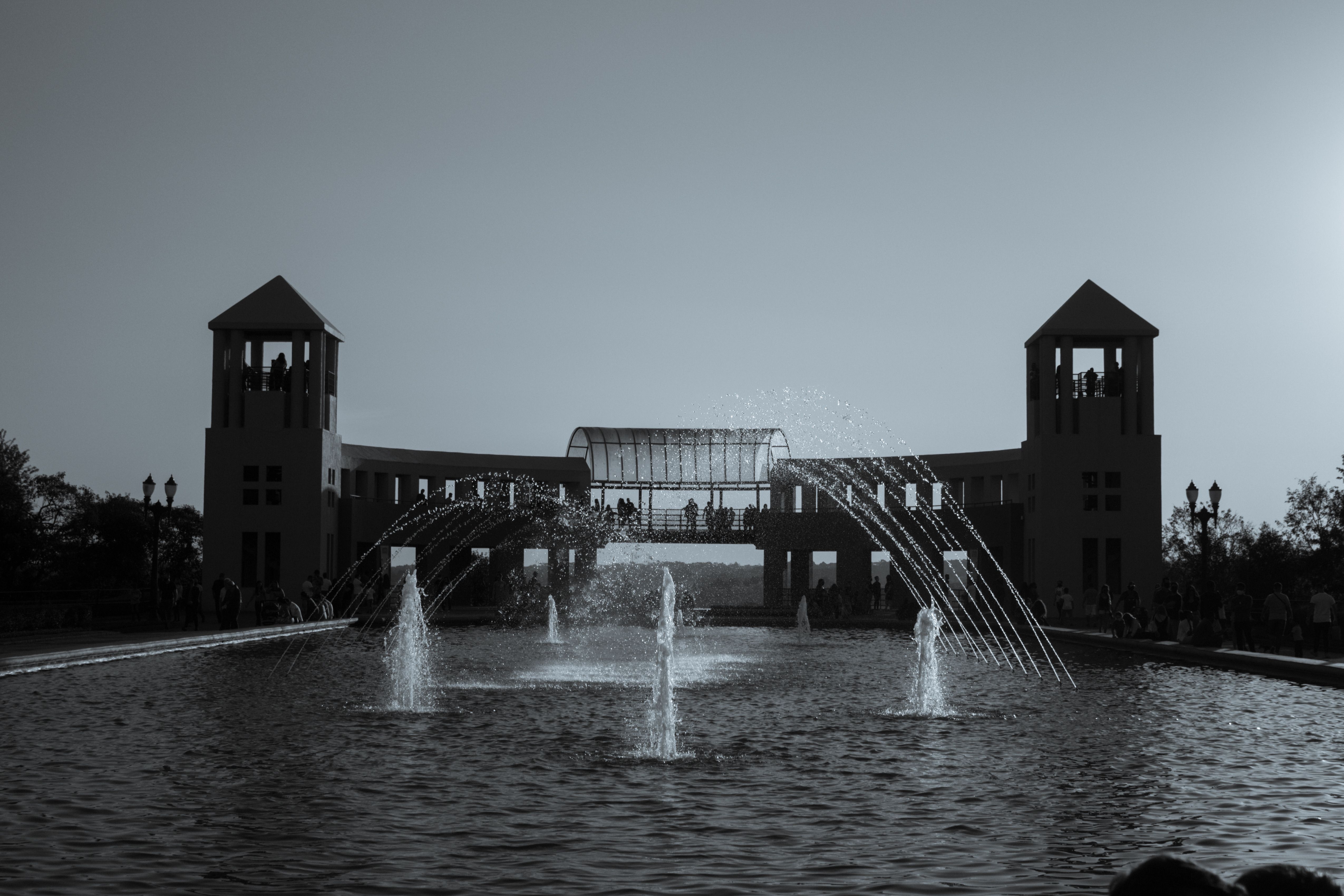 Artistic monochrome capture of fountains at Parque Tanguá in Curitiba, Brazil.