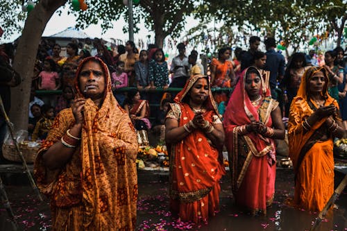Hindu Women Standing in a River during a Religious Ceremony 