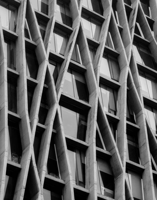 Black and white photo of a modern building facade with unique design in Dhaka, Bangladesh.