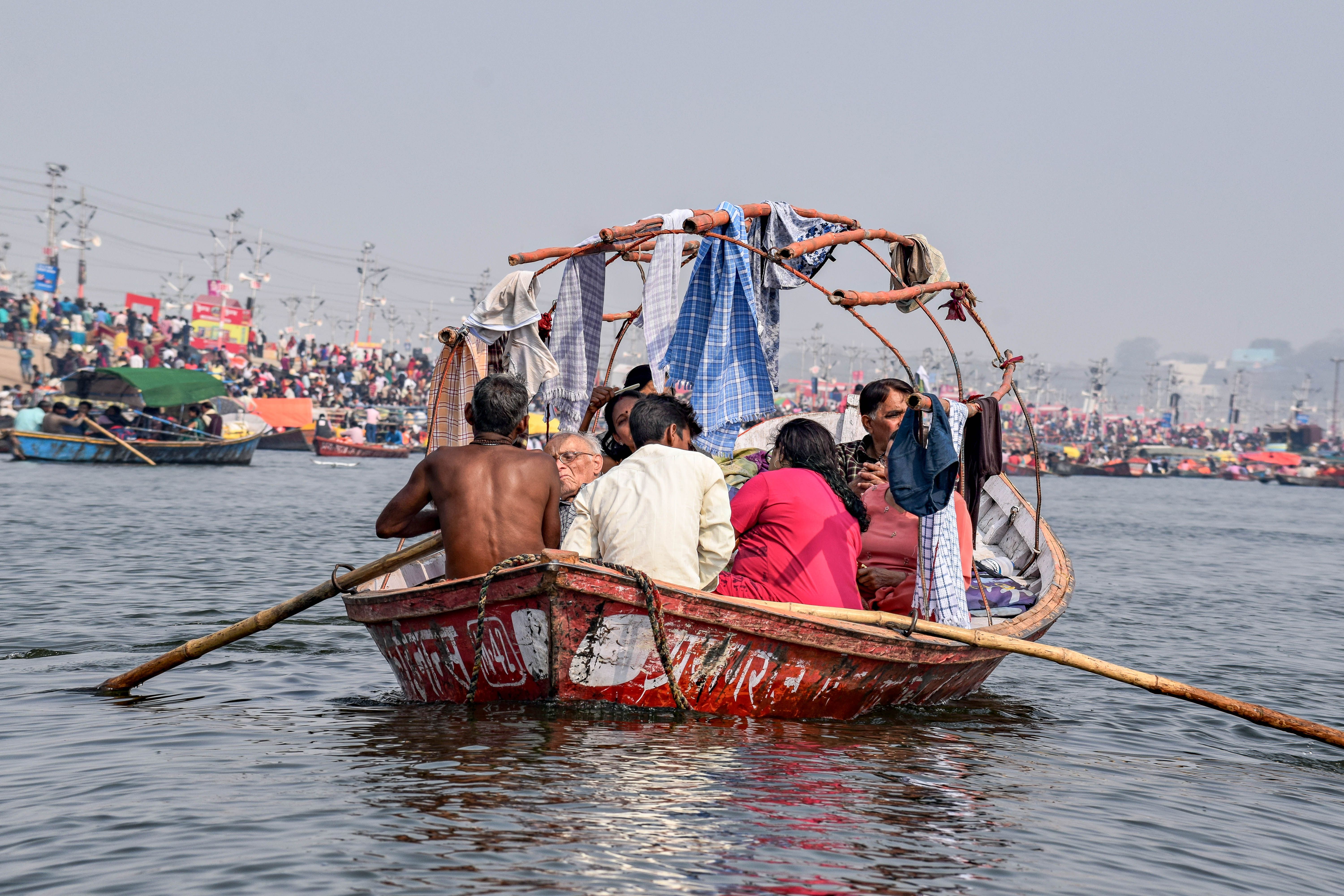 Group of People on a Boat with Oars · Free Stock Photo