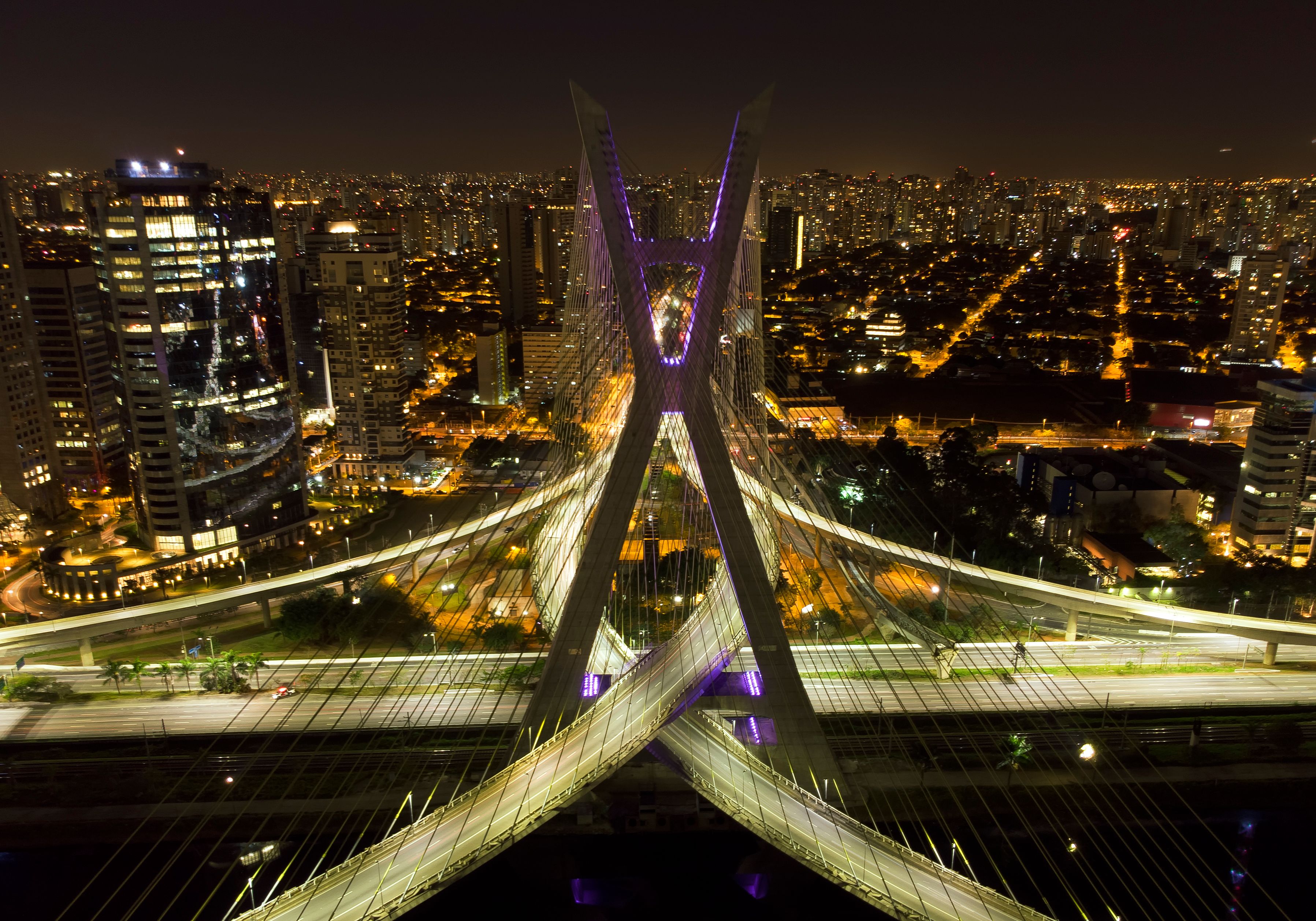 Stunning aerial night view of São Paulo's Octávio Frias de Oliveira bridge with city lights. - São Paulo