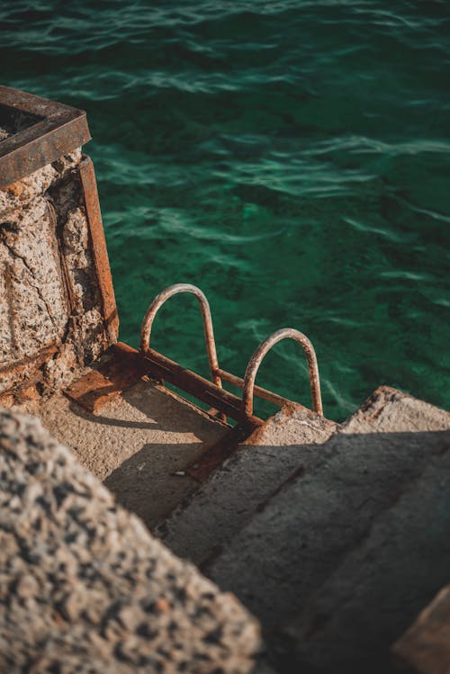 Gray Concrete Stairs Near Body of Water