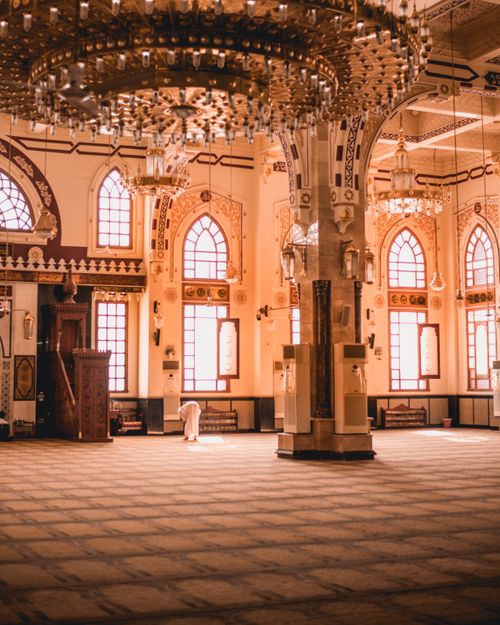 Free Beautiful mosque interior showcasing intricate ceilings and chandeliers, highlighting Islamic architecture and design. Stock Photo