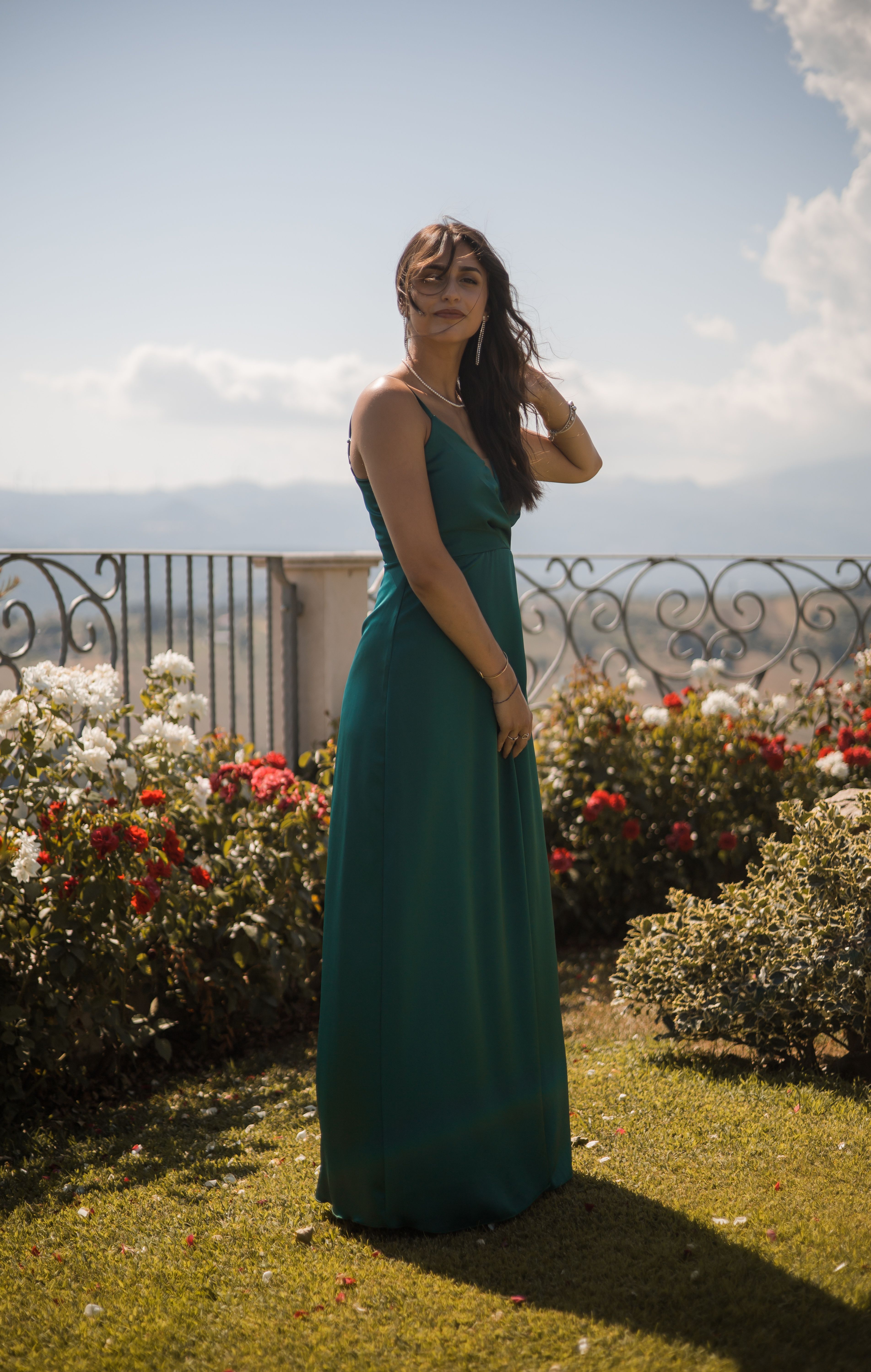 Woman Posing in Green Dress in a Garden  Free Stock Photo