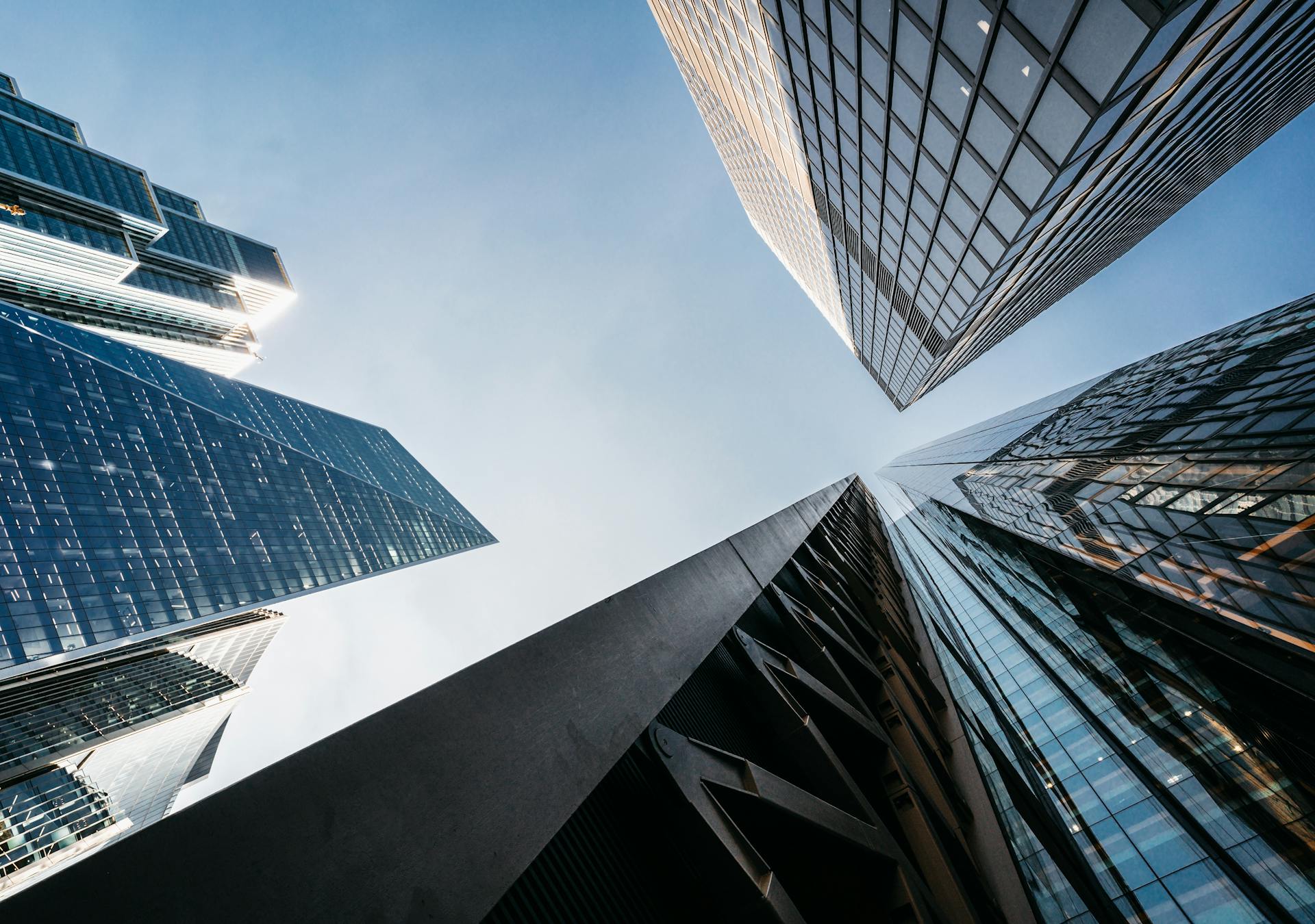 A striking upward view of modern skyscrapers in London's financial district.