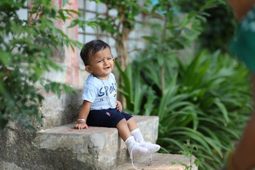 Boy Sitting on Stairs