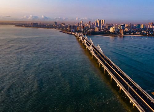 Free Stunning aerial view of Tanzanite Bridge and skyline in Dar es Salaam at sunset. Stock Photo