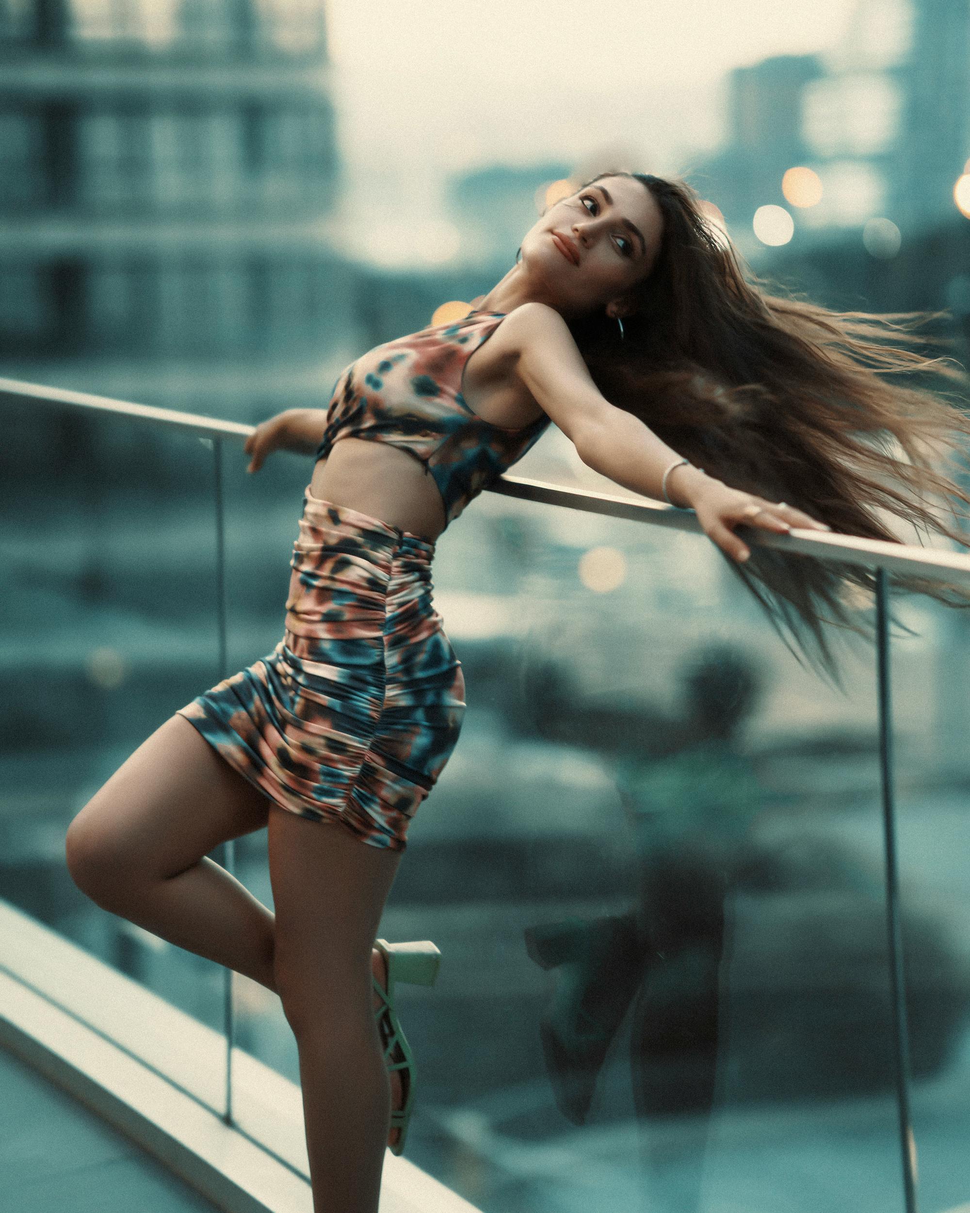 Woman in a Dress Posing on a Balcony of a Modern Building in City · Free  Stock Photo