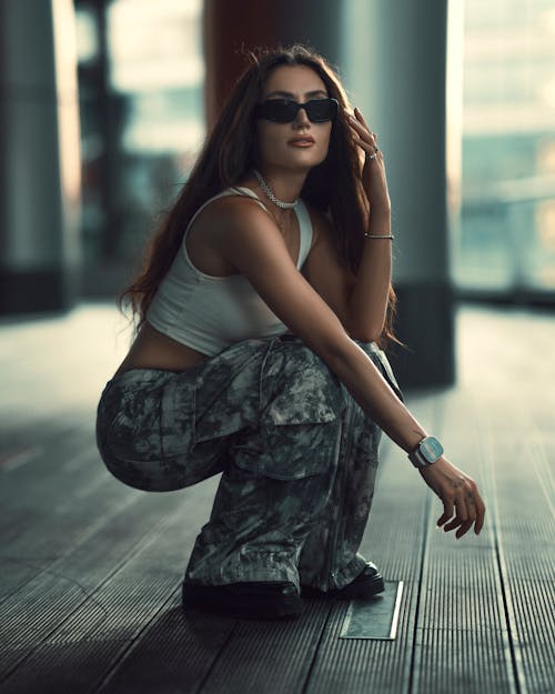 Brunette Woman with Sunglasses Crouching