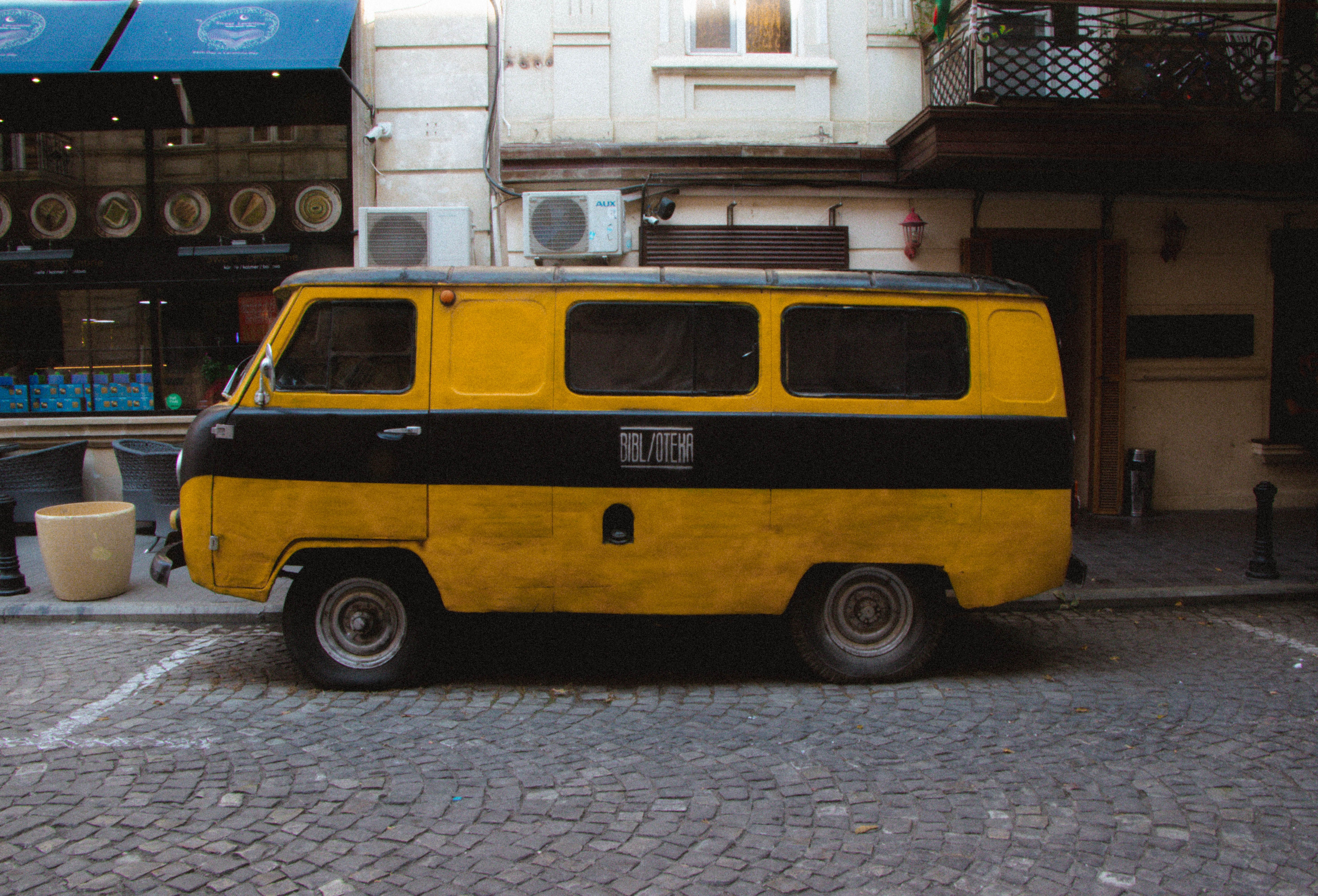 Vintage Yellow Van Standing on the Street · Free Stock Photo