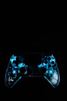 Brightly lit gaming controller against a dark backdrop capturing technology and gaming essence.