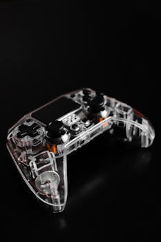 A translucent gaming controller on a sleek black background showcasing modern tech design.