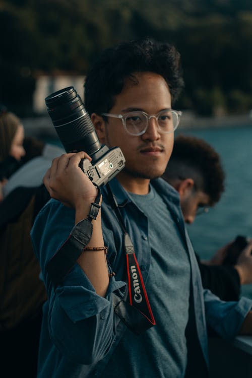 Portrait of Man Holding a Camera