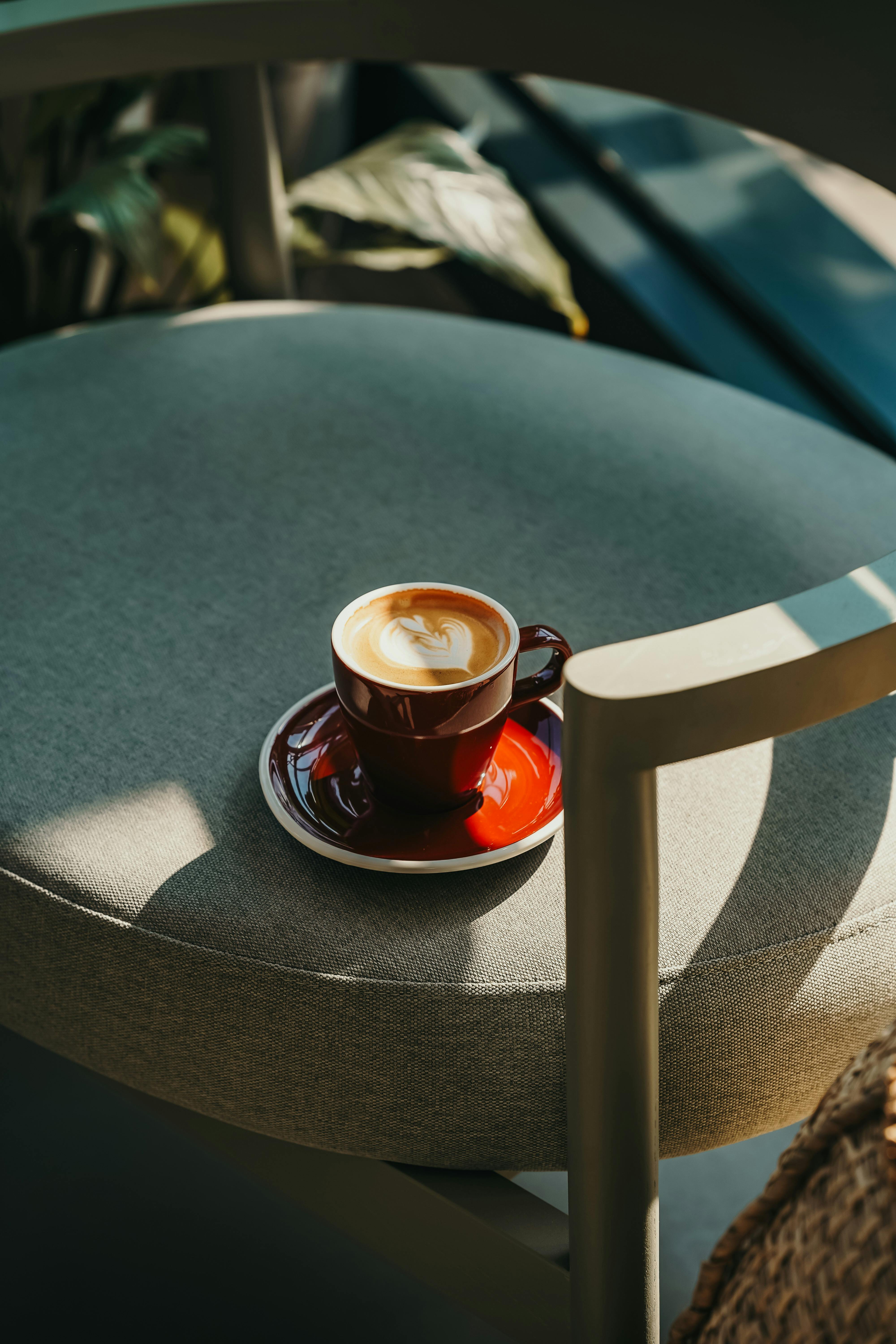 Cup of Coffee on a Chair · Free Stock Photo