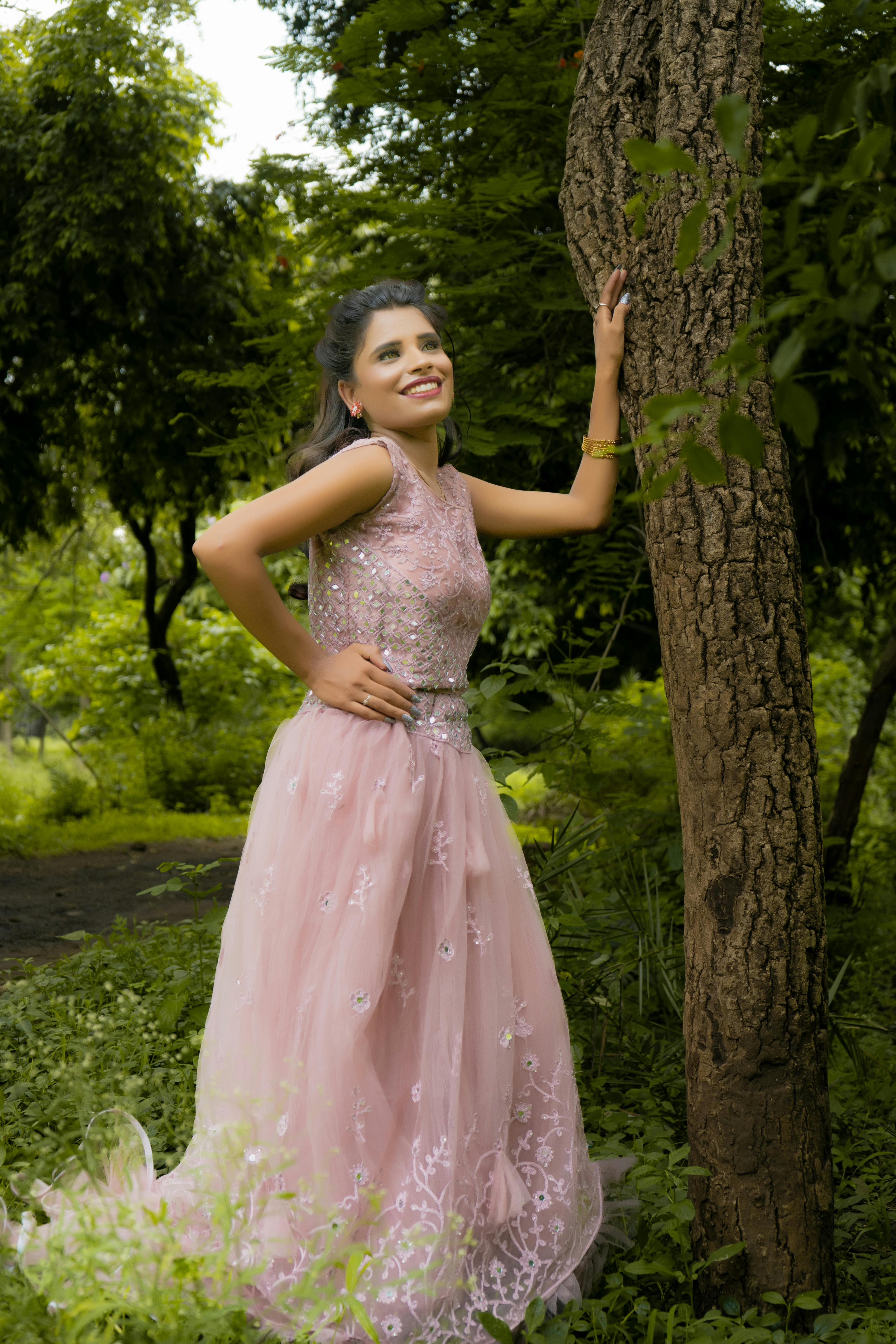 Beautiful woman model dressed in an elegant dress in a fashion pose Stock  Photo by ©matusciac 21453087