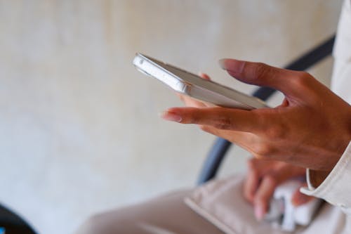 Texting on a Silver Smartphone