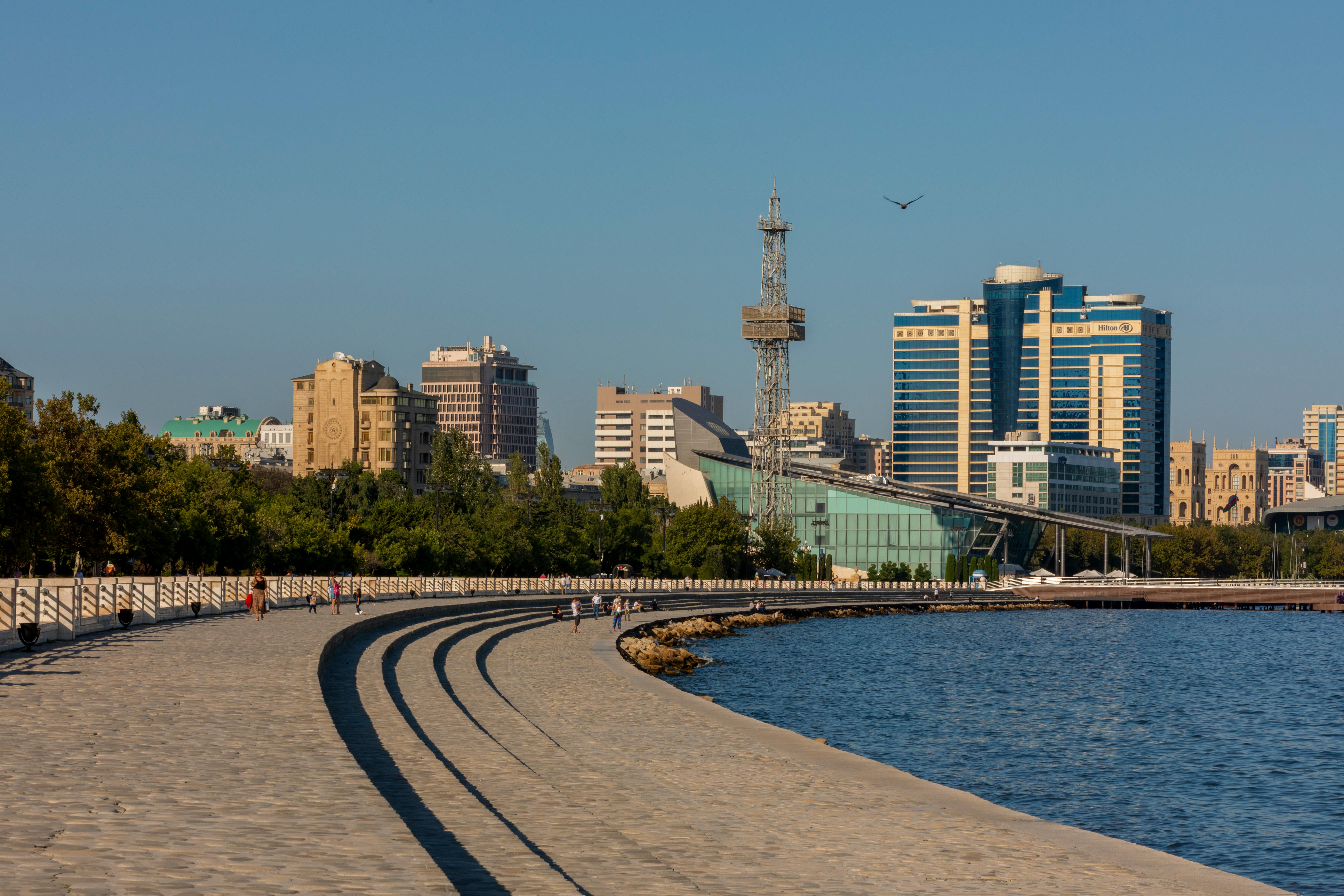 Explore Baku's skyline from the scenic boulevard along the Caspian Sea, capturing urban life and architecture.
