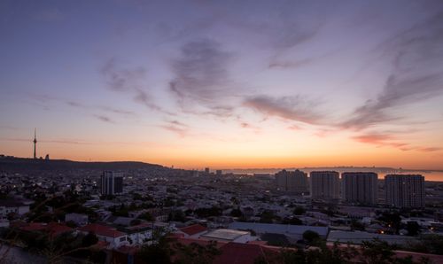 Free Stunning aerial view of Baku, Azerbaijan cityscape during sunset with the Caspian Sea. Stock Photo