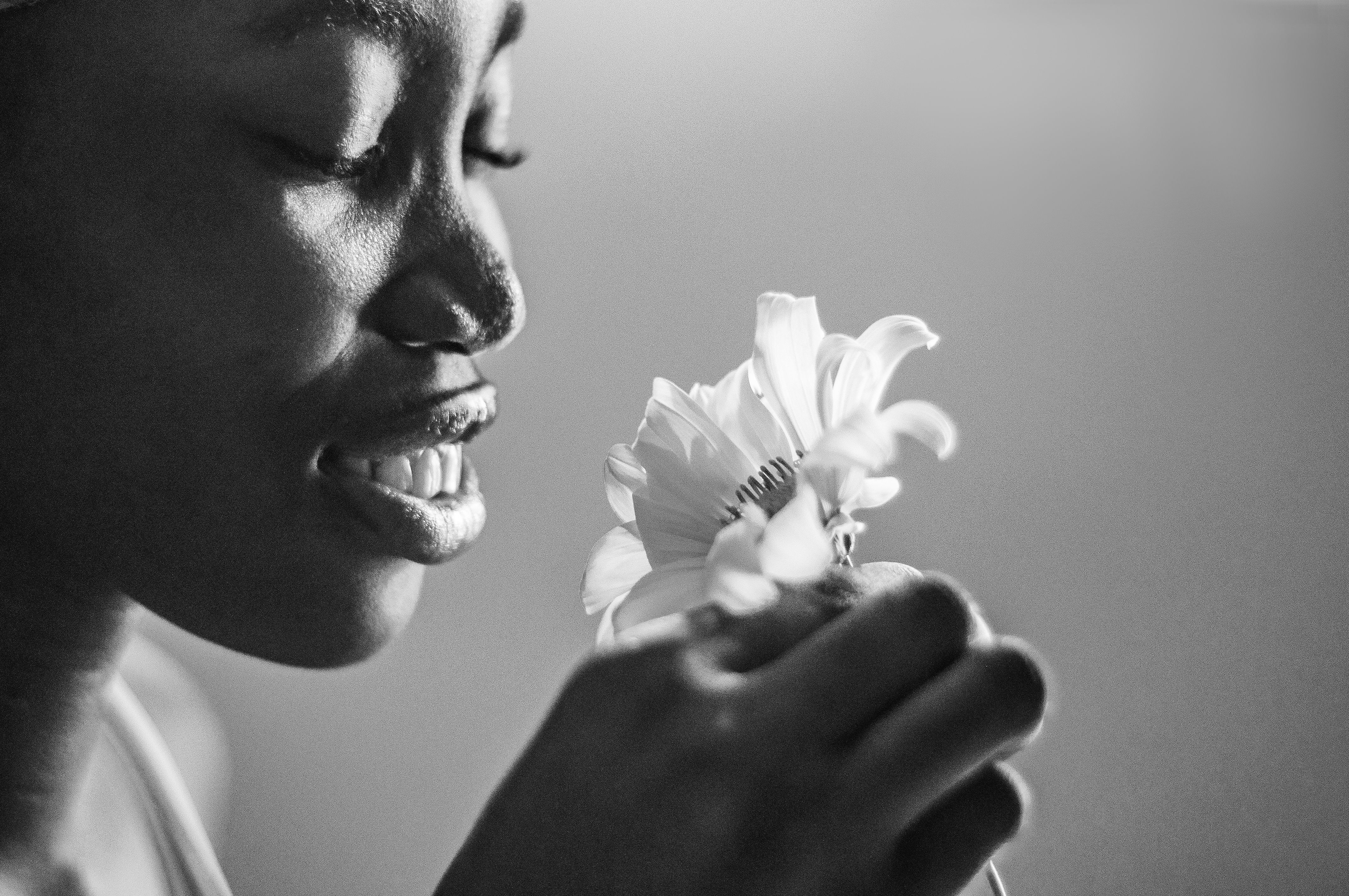 Woman Holding Flower in Black and White · Free Stock Photo