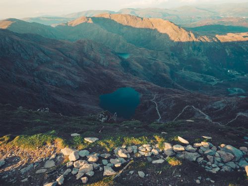 Free A stunning aerial view of tranquil lakes surrounded by rugged mountain terrain under a clear sky. Stock Photo