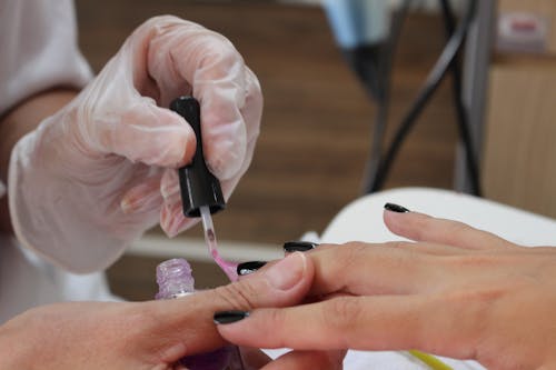 Close up of Applying Nail Polish at Beautician