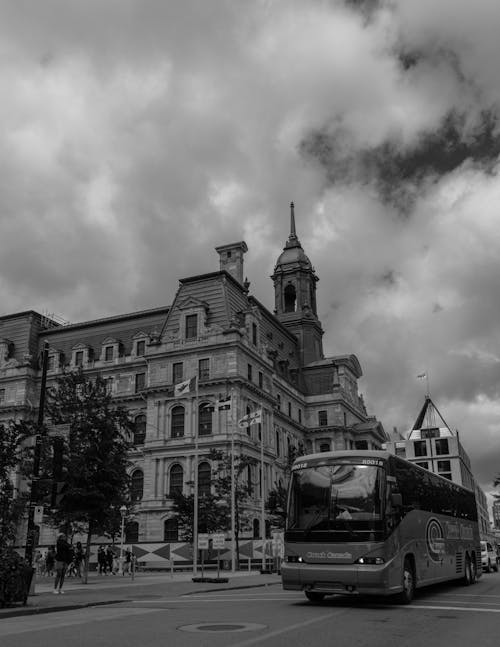 Free Bus near Vintage Building in Town Stock Photo