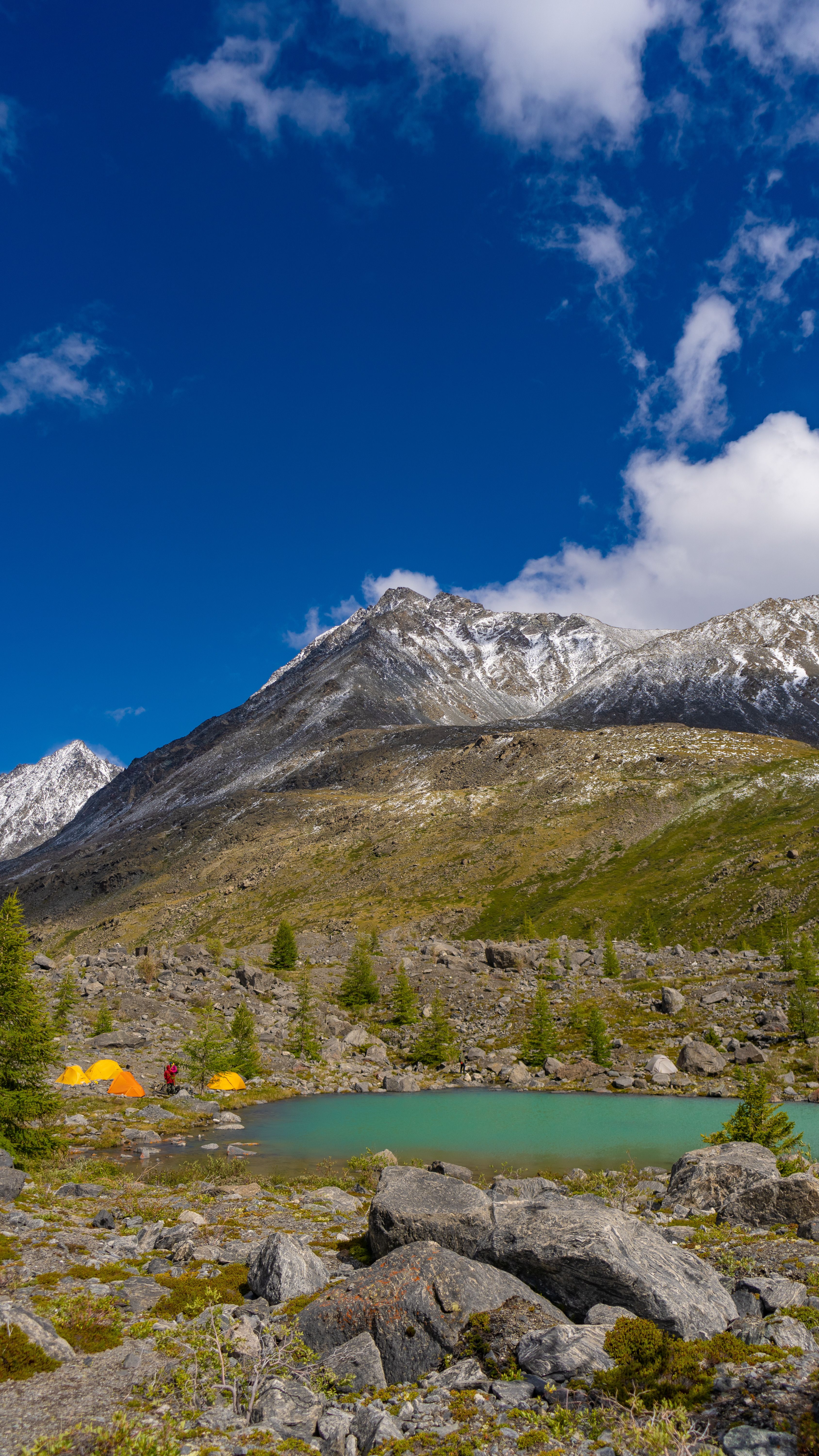 Lake under Mountains Slope · Free Stock Photo