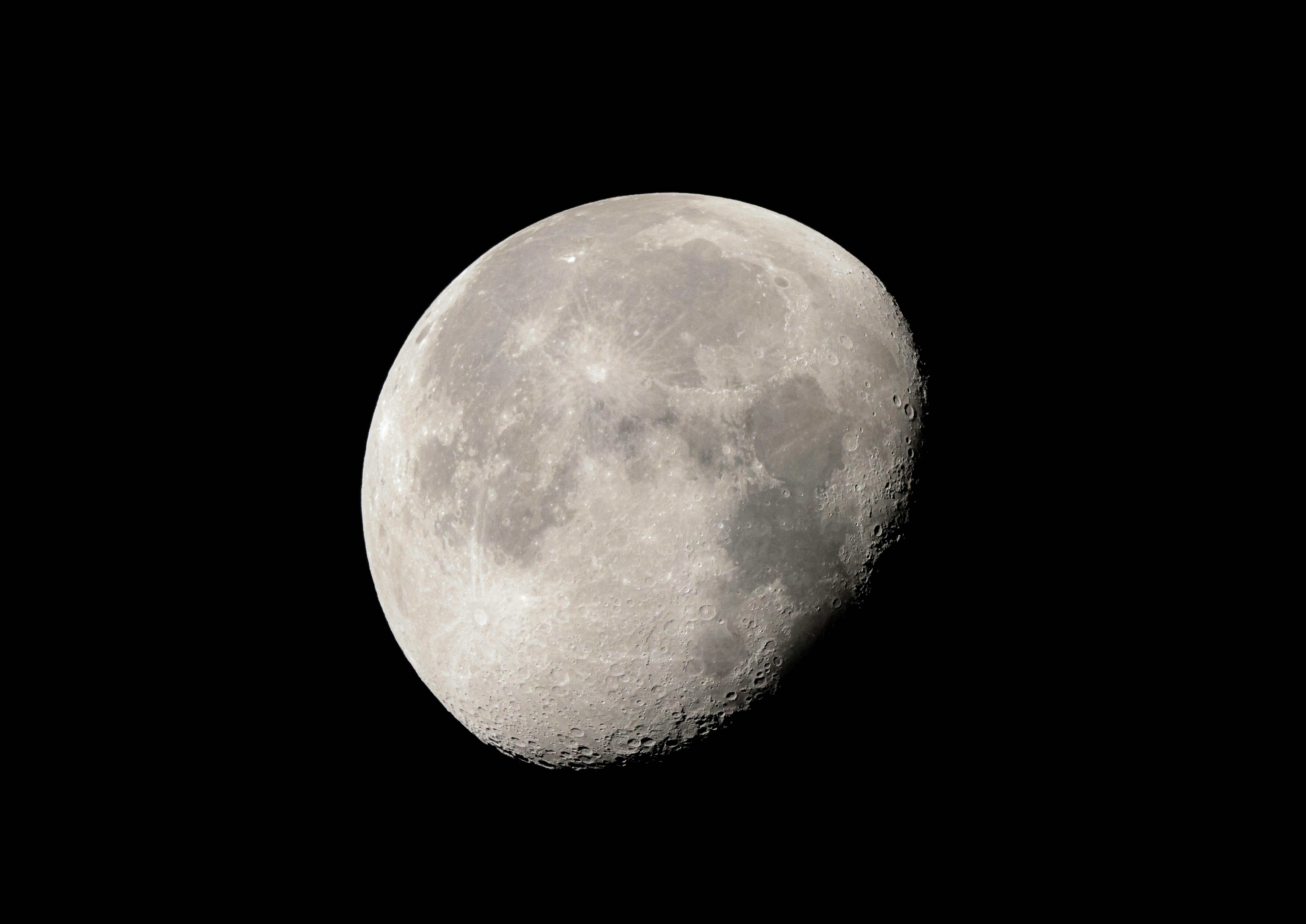 High-resolution image of the moon showcasing lunar details in a dark night sky.